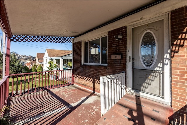 entrance to property with a porch