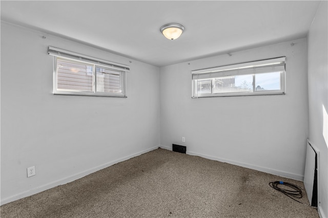 unfurnished room with carpet floors