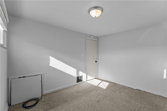 spare room with light carpet