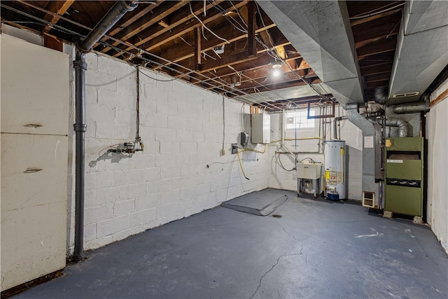 basement featuring electric panel, water heater, sink, and heating unit