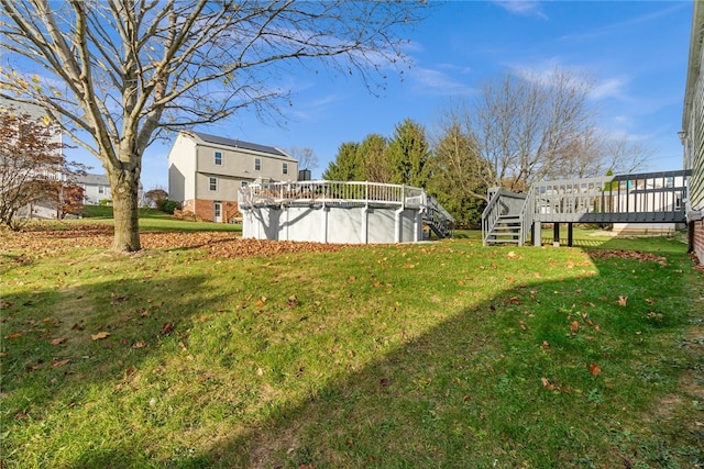 view of yard featuring a swimming pool side deck