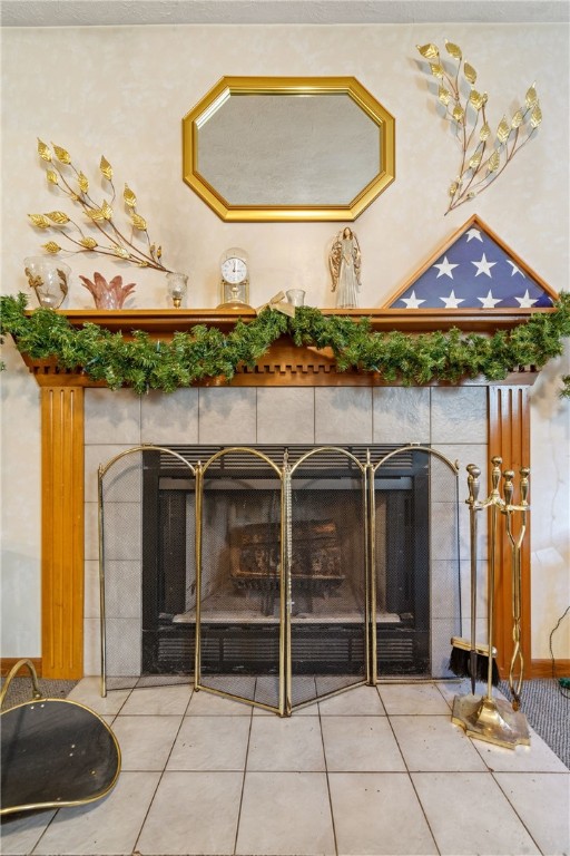 details with a tiled fireplace