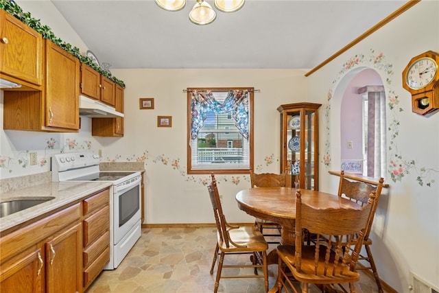 kitchen with electric range and sink