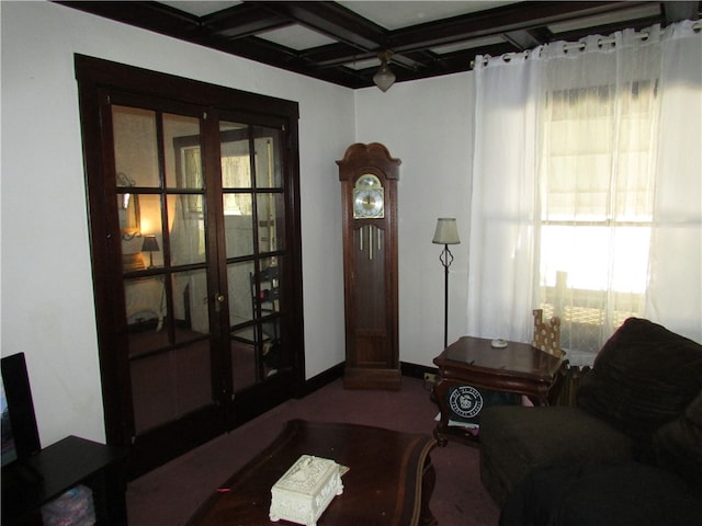 carpeted living room with coffered ceiling, a wealth of natural light, and beam ceiling