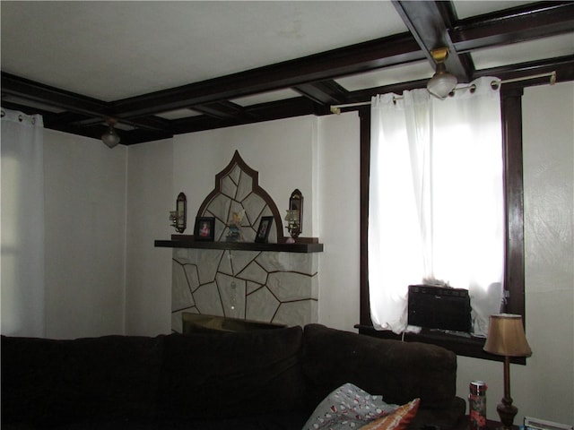 living room featuring beamed ceiling