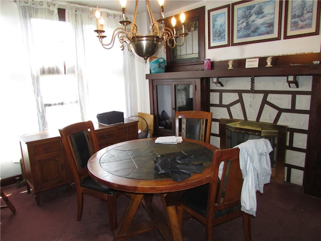 dining space featuring a notable chandelier