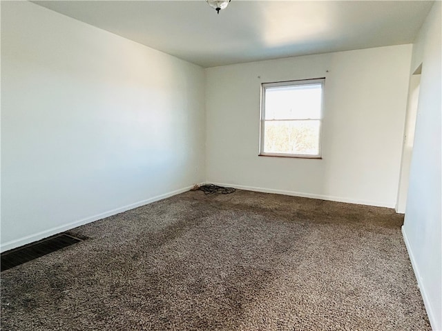 spare room featuring carpet floors