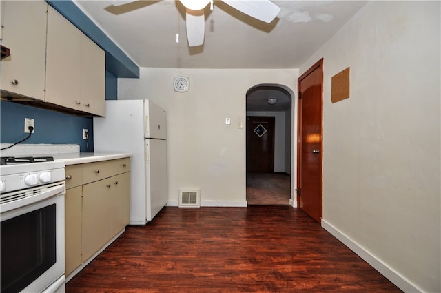 kitchen featuring dark hardwood / wood-style flooring, white appliances, and ceiling fan