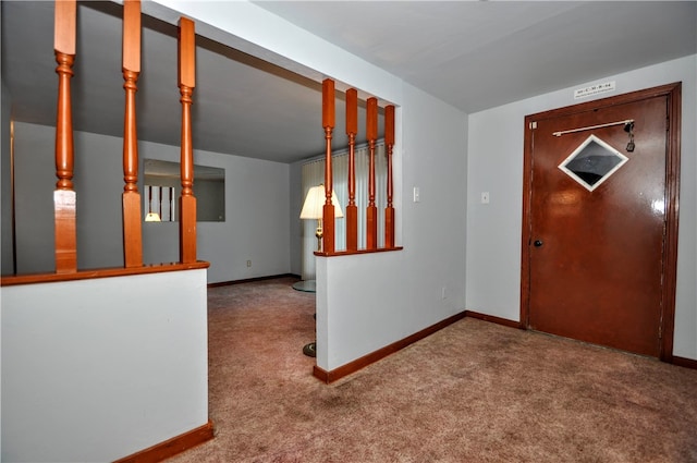 view of carpeted foyer