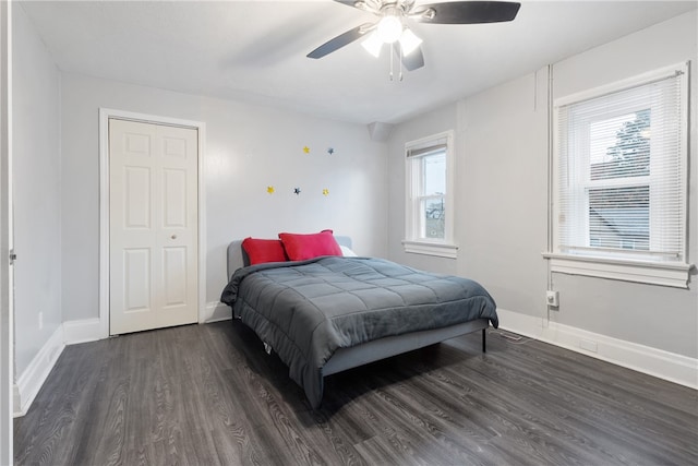 bedroom featuring ceiling fan and dark hardwood / wood-style floors