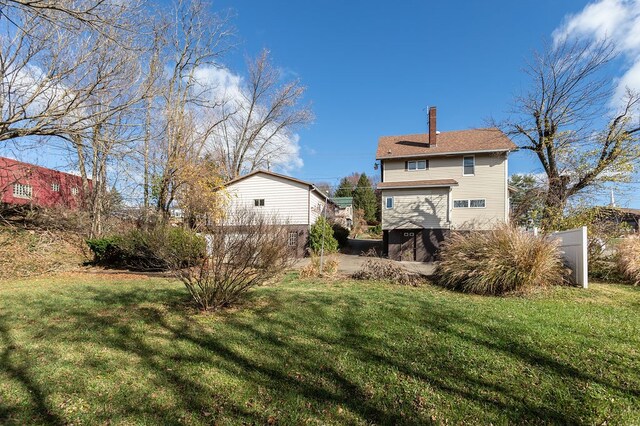 back of property with a yard