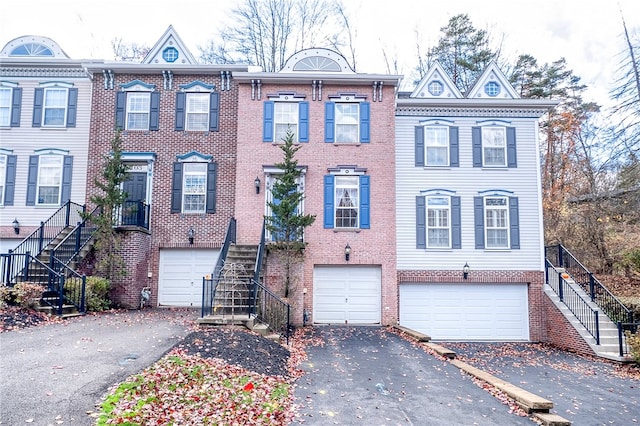 townhome / multi-family property featuring a garage