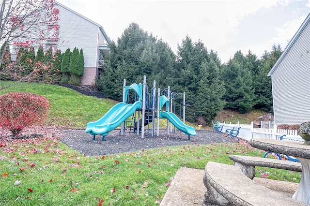 view of playground featuring a lawn