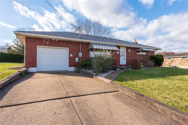 single story home featuring a front yard and a garage