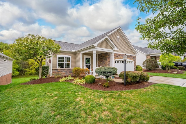 view of front of property with a front yard and a garage