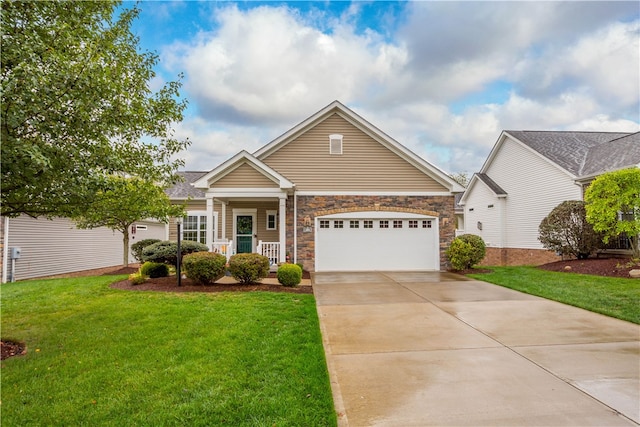 view of front of house featuring covered porch, a front yard, and a garage