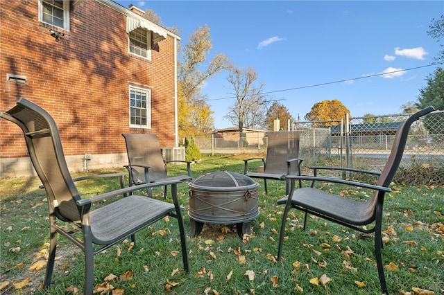 view of home's community featuring an outdoor fire pit