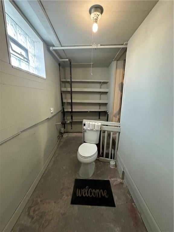 1447 Fleming Ave, Mckees Rocks, PA 15136 - bathroom with concrete flooring, toilet, and baseboards