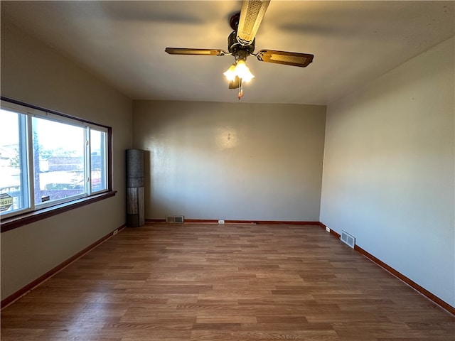 spare room featuring ceiling fan and hardwood / wood-style floors