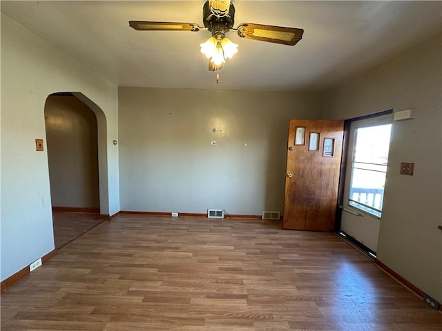 1447 Fleming Ave, Mckees Rocks, PA 15136 - interior space featuring ceiling fan, arched walkways, wood finished floors, and baseboards