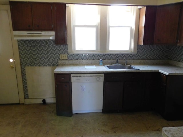 kitchen with backsplash, dishwasher, dark brown cabinets, and sink