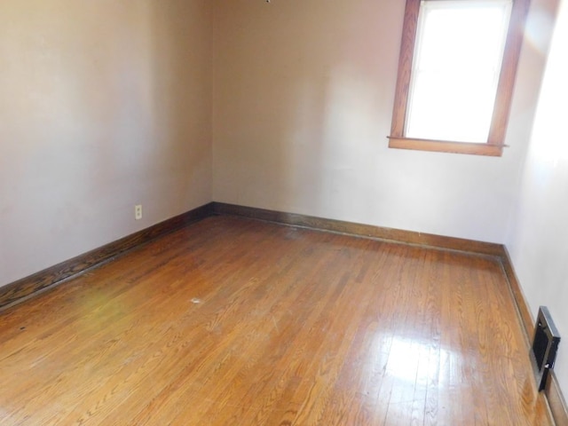 unfurnished room featuring light hardwood / wood-style flooring