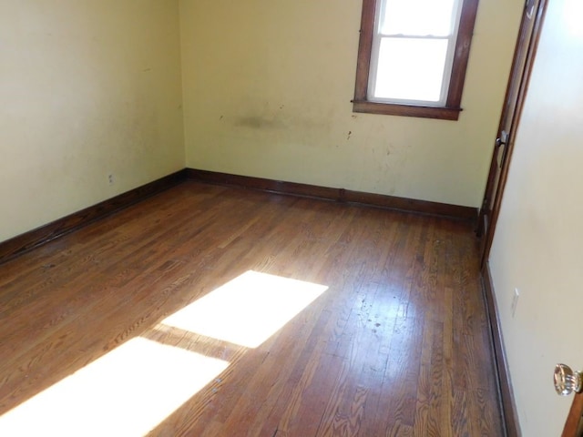 empty room featuring dark hardwood / wood-style floors