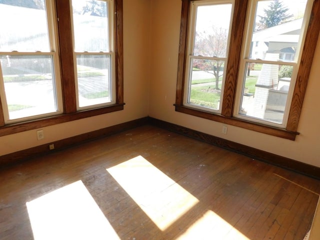 unfurnished room featuring dark hardwood / wood-style flooring