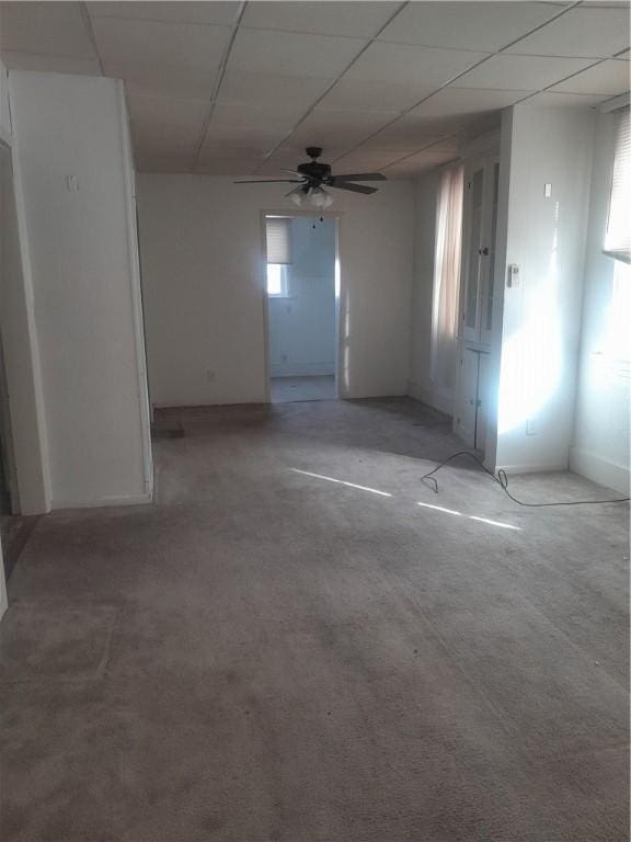 unfurnished room with a ceiling fan and a paneled ceiling