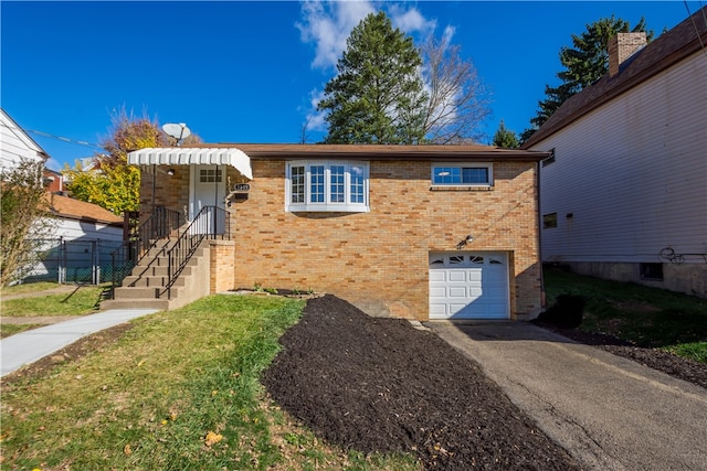 view of front of home with a garage and a front yard