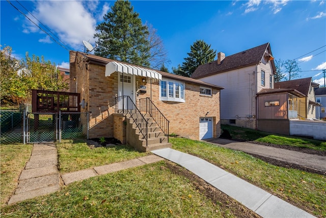 view of front of property with a garage and a front yard