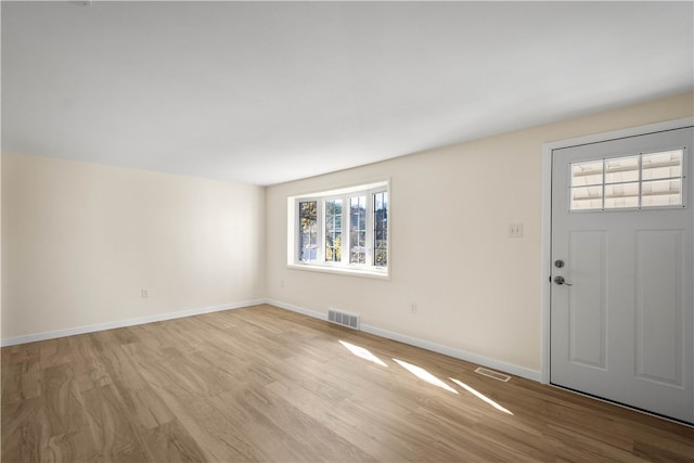 entrance foyer featuring light hardwood / wood-style floors