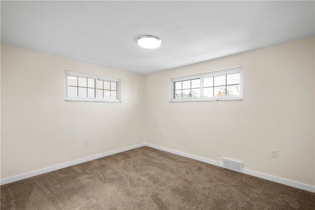 unfurnished room with carpet flooring