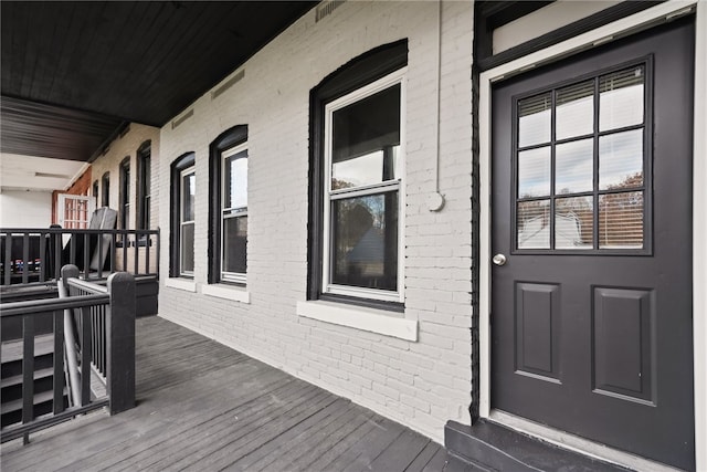 doorway to property featuring a porch