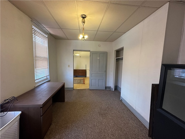 interior space featuring a drop ceiling