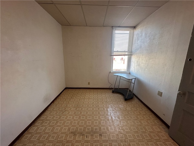 spare room with a paneled ceiling