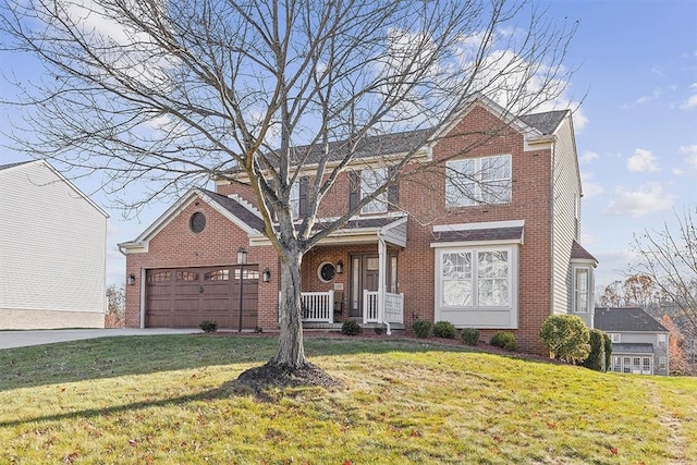 view of front property featuring a front lawn, a porch, and a garage