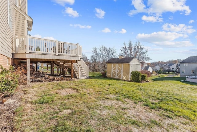 view of yard featuring a deck and a storage unit