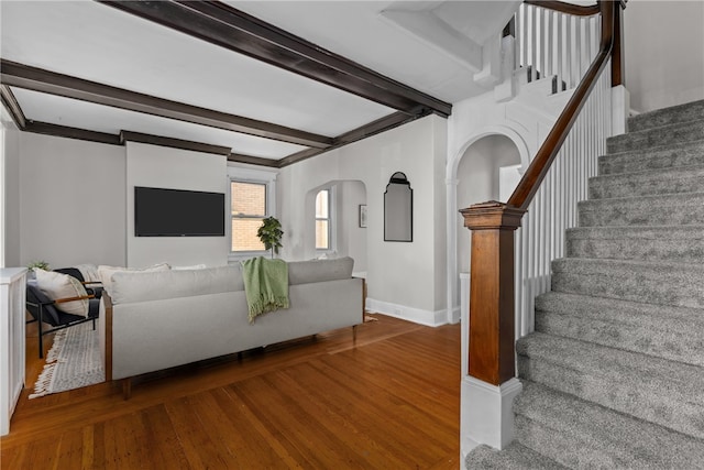 living room with beam ceiling and hardwood / wood-style flooring