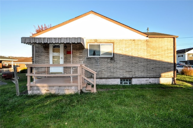 rear view of house with a lawn