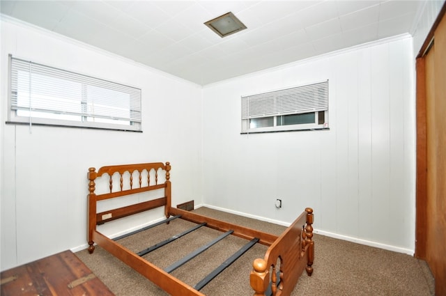 carpeted bedroom featuring ornamental molding