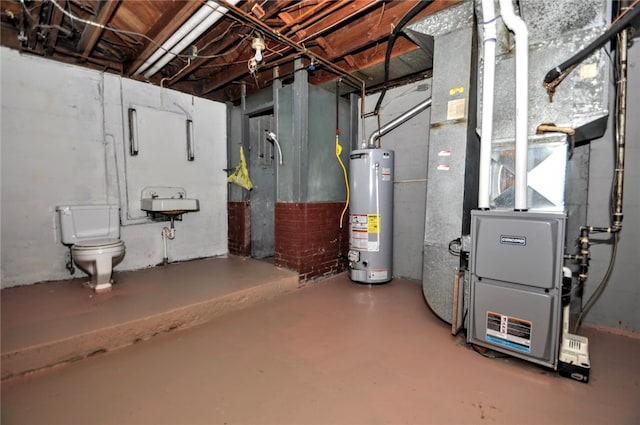 basement featuring gas water heater and sink