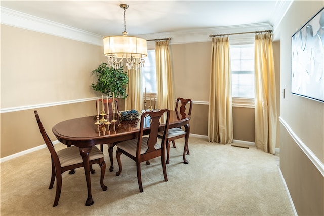 carpeted dining space featuring an inviting chandelier and ornamental molding