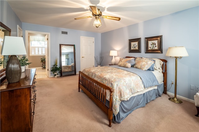 bedroom with light carpet and ceiling fan