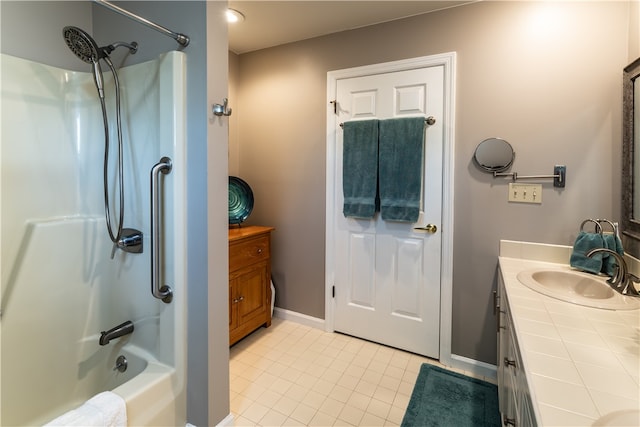 bathroom featuring tile patterned floors, vanity, and tub / shower combination