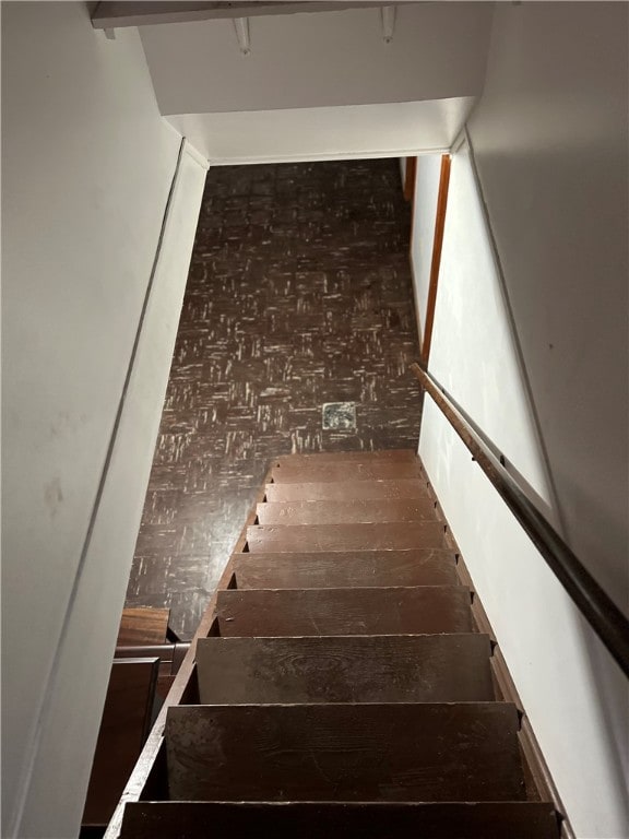 staircase featuring hardwood / wood-style flooring