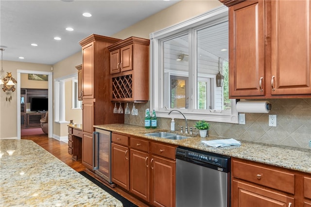 kitchen featuring dishwasher, sink, dark wood-type flooring, beverage cooler, and decorative backsplash