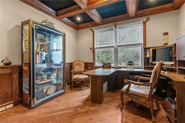 sitting room featuring crown molding, beamed ceiling, coffered ceiling, and light wood-type flooring