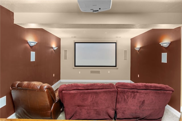 cinema room featuring carpet flooring