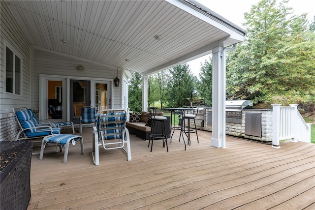 wooden deck with area for grilling